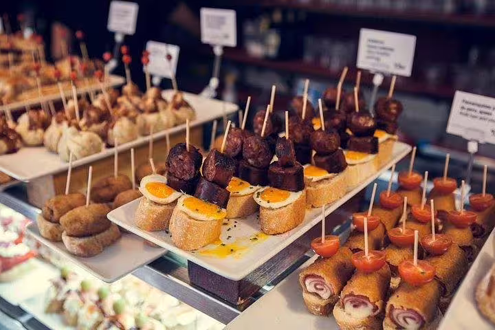 A vibrant display of Spanish tapas with skewers on a food tasting tour, ideal for a culinary adventure in Barcelona.