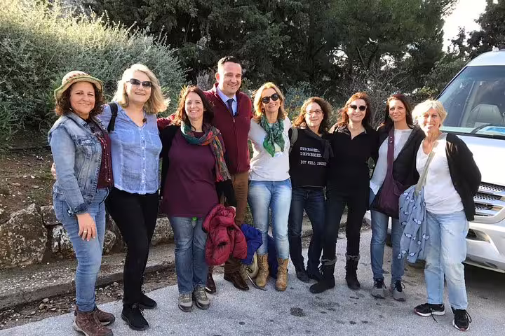 Happy travelers group photo on Sparta full day tour, guided excursion with minivan pickup in Peloponnese