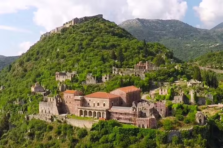 Mystras Byzantine ruins and monastery on green hillside near Sparta, Peloponnese, full day tour view