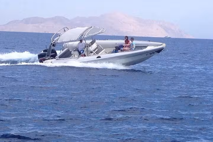 Speed boat racing across the Red Sea near Sharm El Sheikh mountains on a 2-hour private trip
