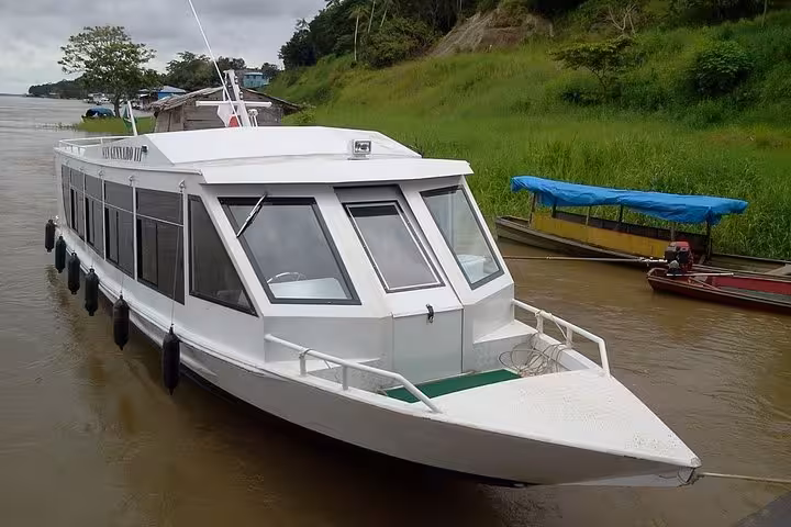Modern Amazon speed boat at dock for Santa Rosa Brazil-Peru border to Iquitos Peru fast river ticket
