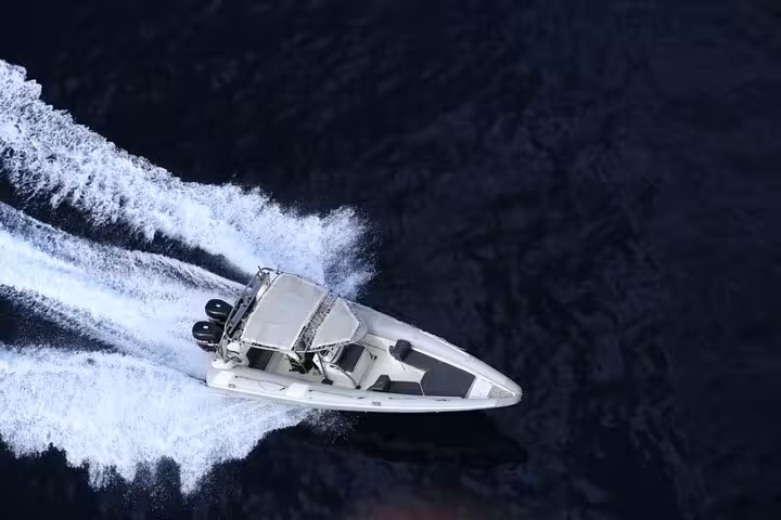 Aerial view of speedboat leaving a foamy wake in Sharm El Sheikh, showcasing a 2-hour Red Sea ride