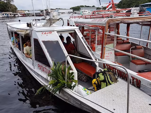 Speedboat transfer on the Amazon River from Manaus to the Rubber Museum, with passengers and luggage onboard