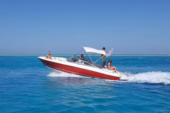 Speedboat cruising the Red Sea in Sharm El Sheikh, shared sea activities tour with snorkeling stop
