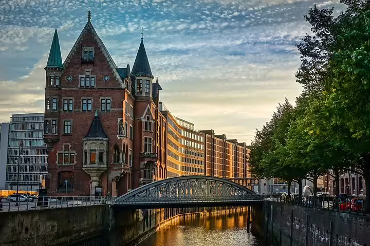Historic Speicherstadt Hamburg canal with bridge at sunset, key landmark on a self-guided e-scavenger hunt