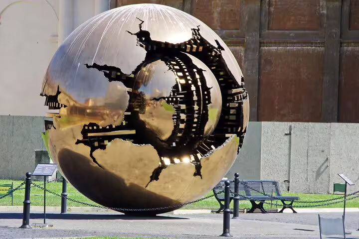 Sphere Within a Sphere sculpture in Vatican Museums courtyard on an exclusive guided Vatican tour in Rome