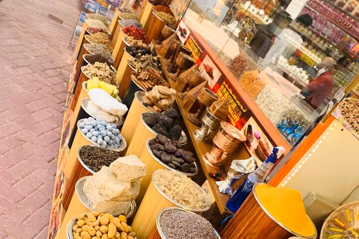 Spice Souk in Old Dubai with colorful herbs, dried fruits and incense on a walking tour