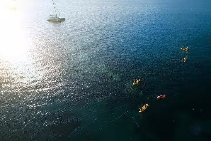 Aerial view of sea kayakers paddling off Split, Croatia, on Adriatic kayaking and snorkeling adventure tour
