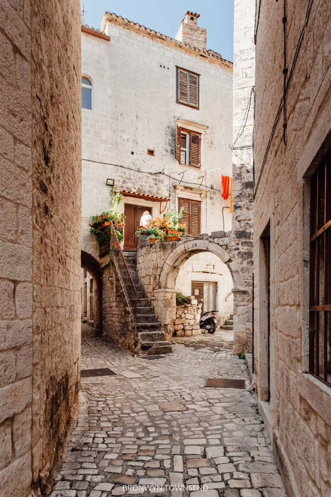 Historic stone lane with archway in Split, Croatia, ideal add-on to a private Krka Waterfalls day trip