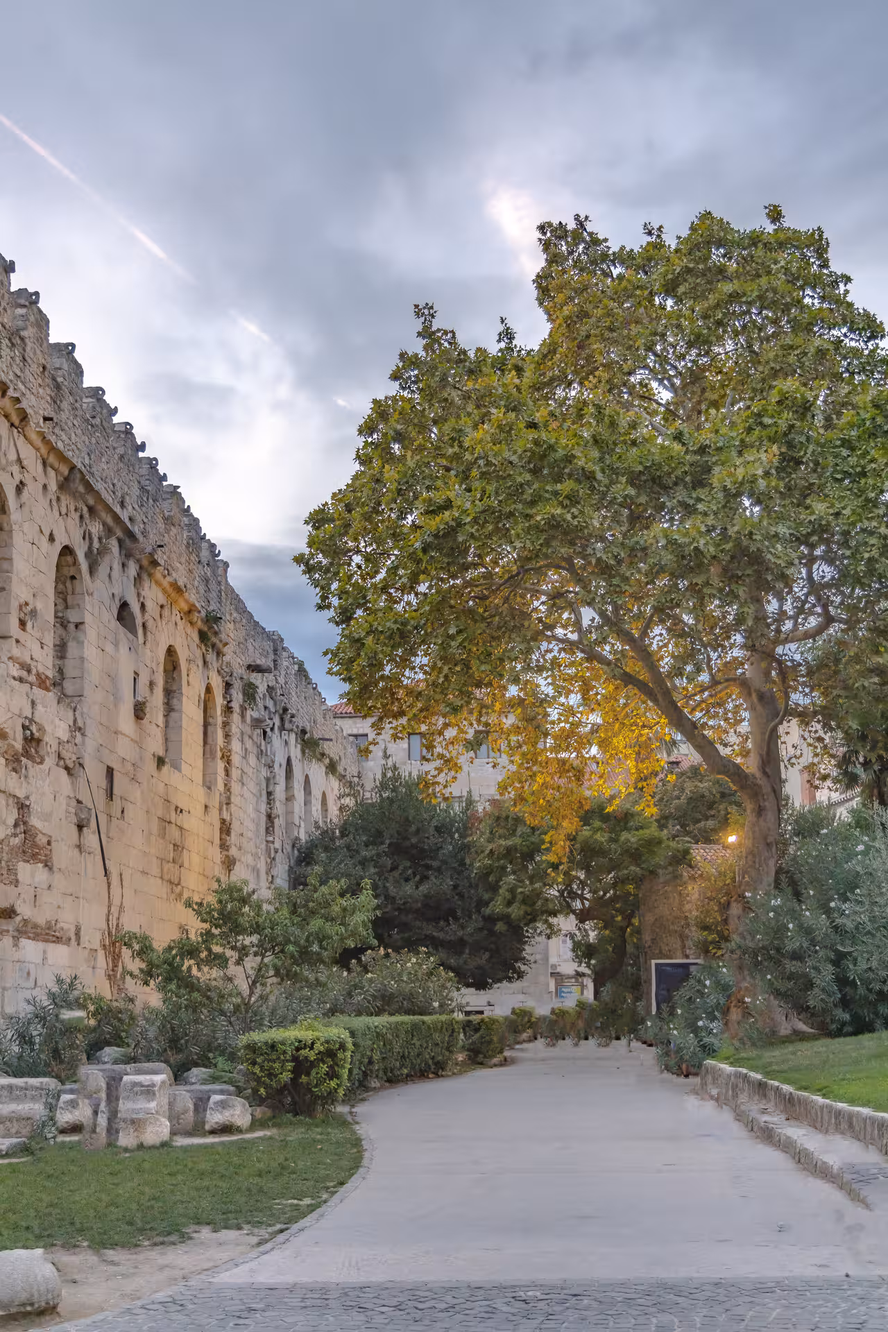 Shaded walkway by Diocletian’s Palace walls in Split Old Town, scenic stop on history city tour to Klis Fortress