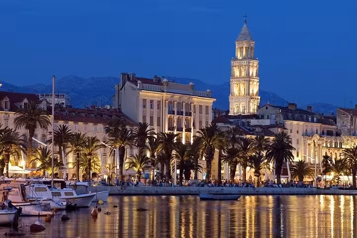 Split Riva waterfront at dusk with Diocletian’s Palace bell tower, start of Split to Zagreb private tour