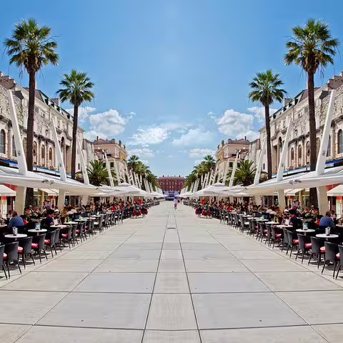 Palm-lined Riva promenade in Split with outdoor cafes, a highlight on Makarska to Split day trip
