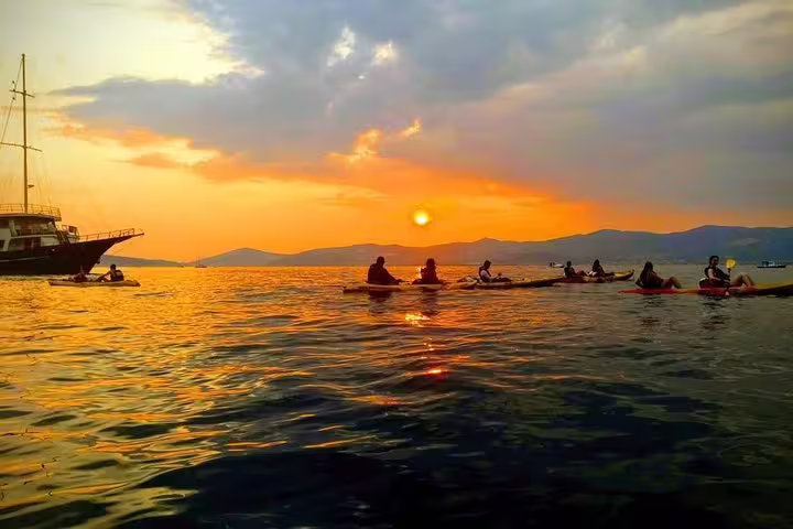 Split sea kayaking tour at sunset with group paddling on Adriatic near Split, Croatia coastline