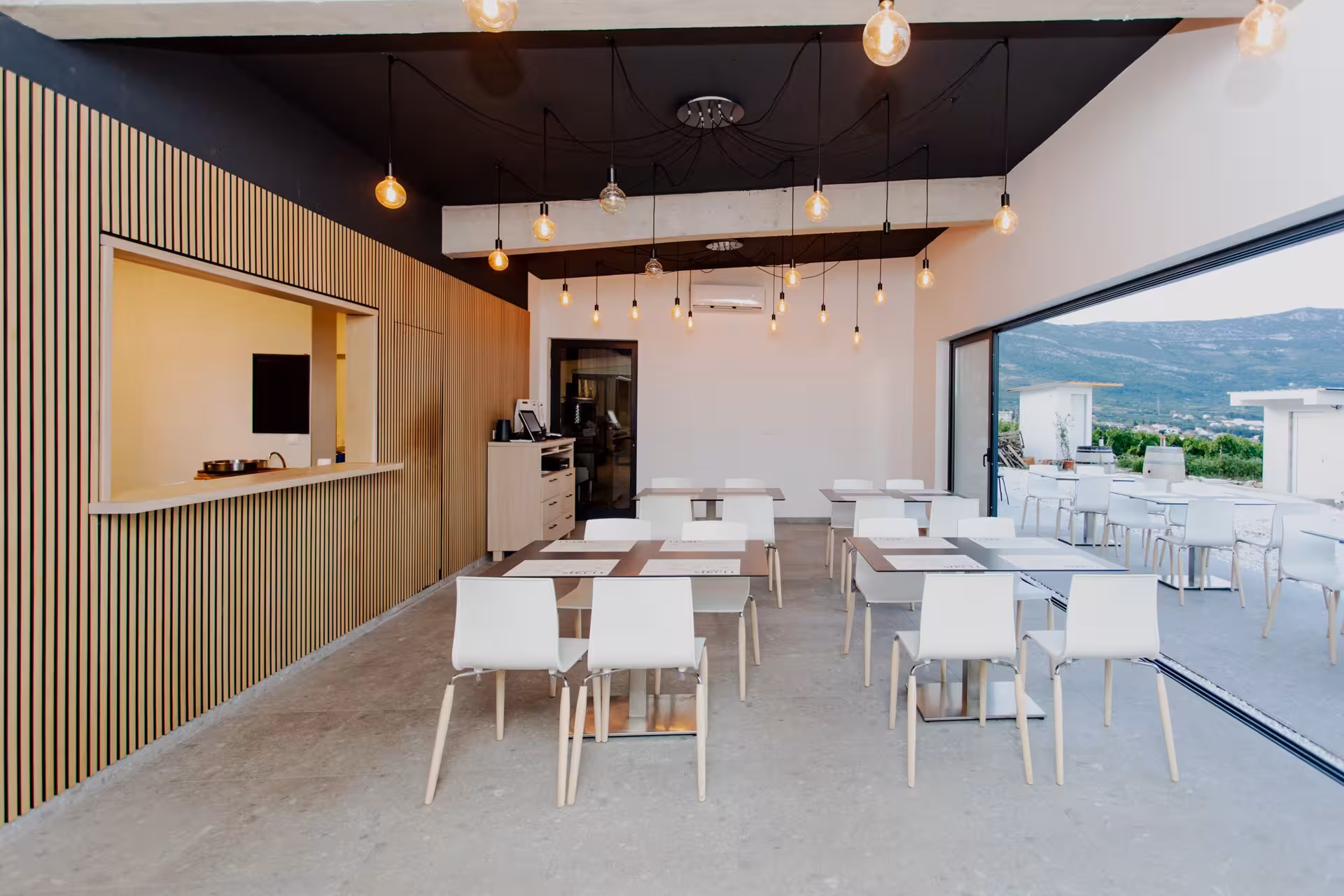 Modern Split dining room for The Taste of Dalmatia wine and food experience with terrace mountain views