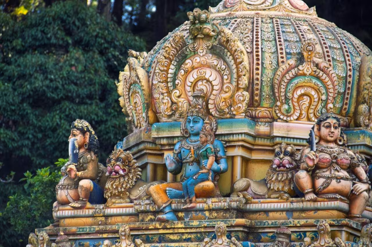 Ornate sculptures adorning a temple facade in Sri Lanka, showcasing rich cultural heritage.