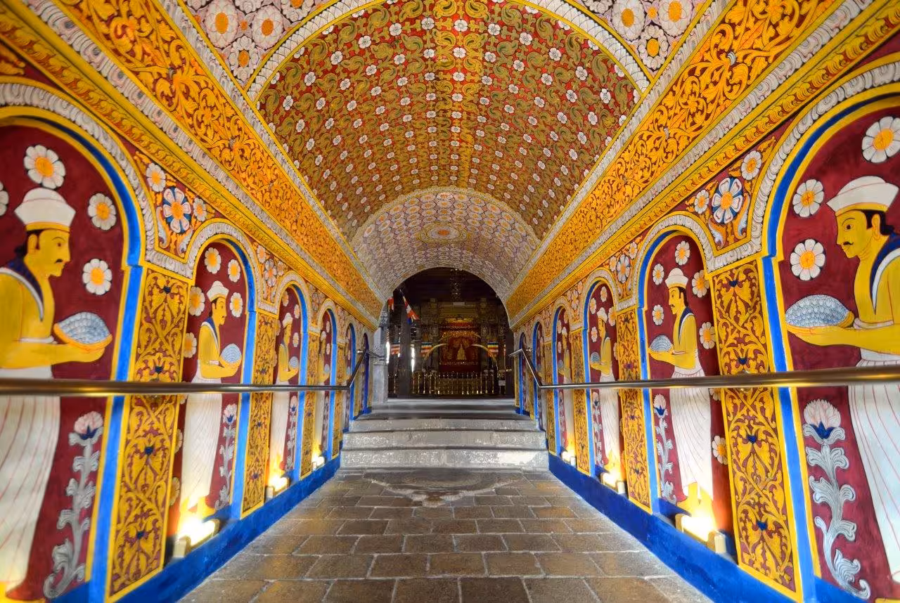 Vibrant murals and intricate ceiling inside Sri Lanka's historic Temple of the Tooth.