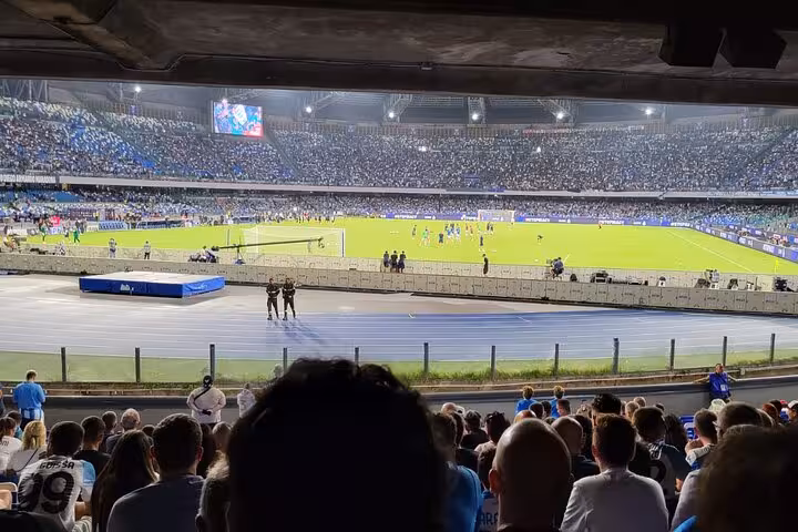 Packed Diego Armando Maradona Stadium during SSC Napoli match, view from stands on local fan experience tour