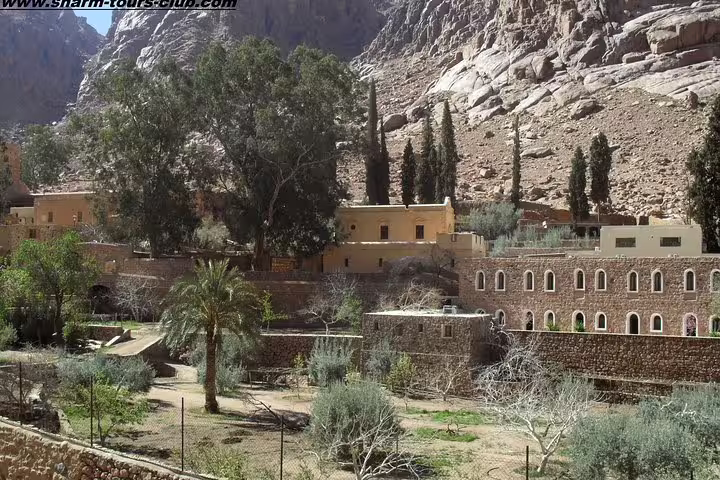 Gardens and stone buildings at St Catherine Monastery, visit on Mount Sinai and St Catherine tour from Sharm