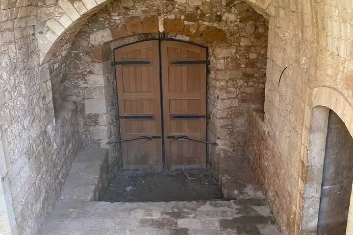 Explore the historic stone architecture of St. Irini Monastery on a private tour from Chania to Rethymno Town.
