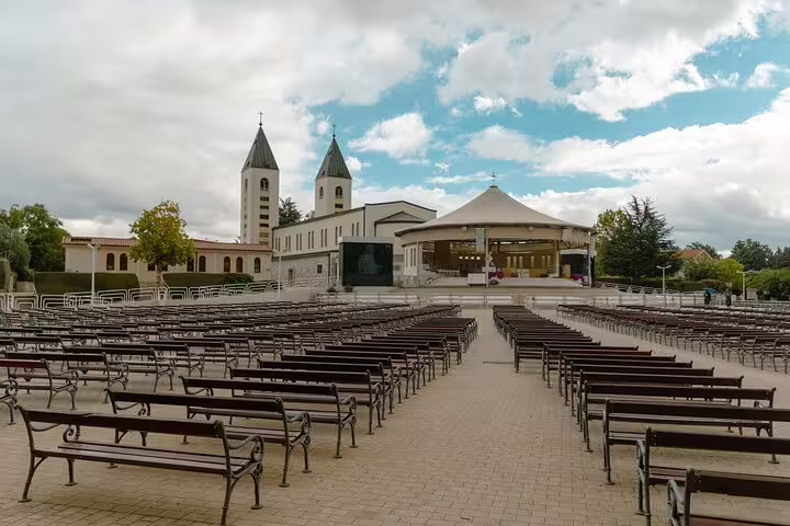 Outdoor altar and seating at St James Church Medjugorje, key site on a private pilgrimage day tour