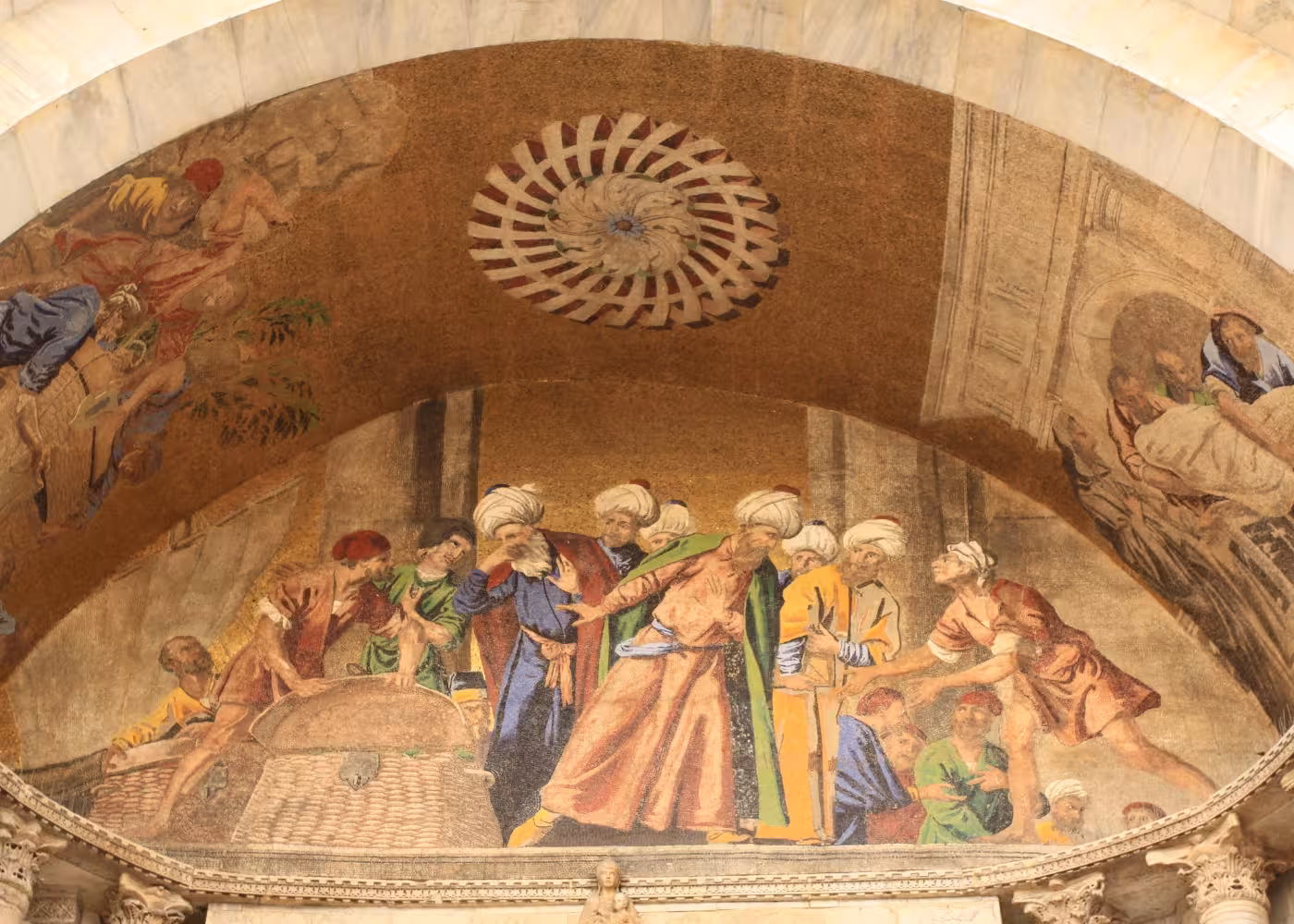 Detailed mosaic artwork inside St Mark's Basilica in Venice, depicting historical scenes with vibrant colors and intricate designs.