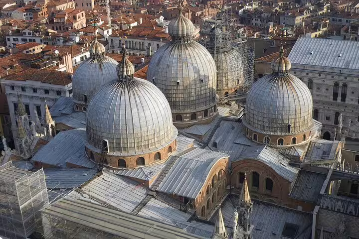 Aerial view of St Mark’s Basilica domes in Venice, highlighting Byzantine architecture on a guided skip-the-line tour