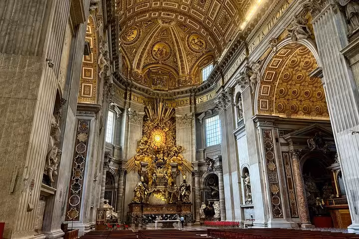 Majestic altar of St. Peter's Basilica on small group tour, highlighting exquisite Vatican craftsmanship and design.
