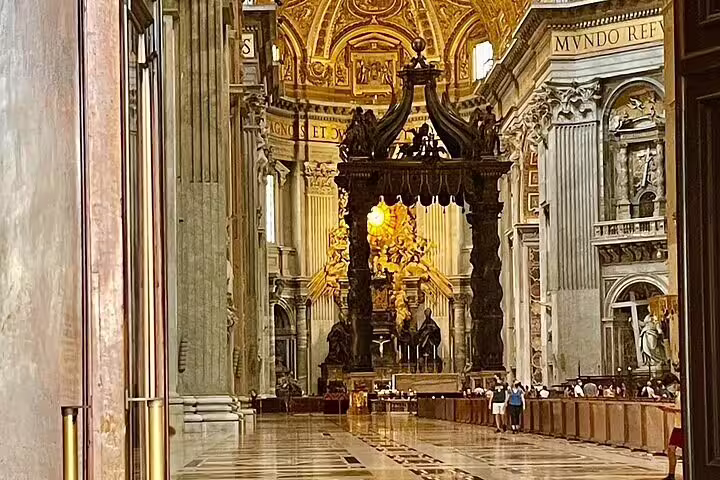 Interior of St Peter's Basilica with Bernini’s Baldachin on a VIP early morning dome climb private tour in Vatican City