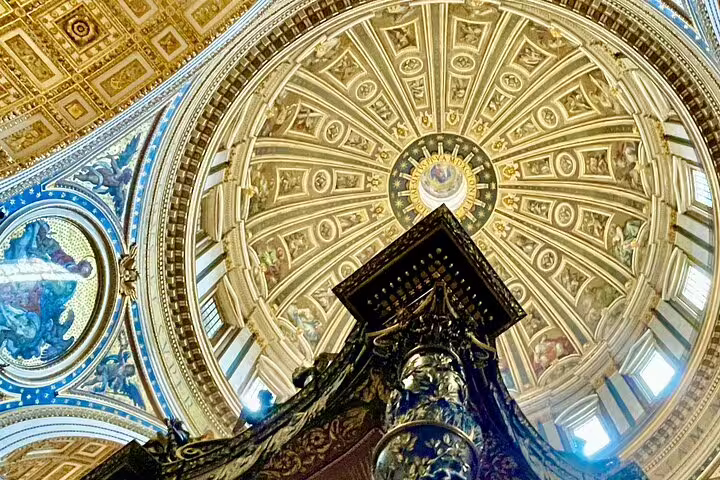 Upward view of St Peter's Basilica dome and ornate Baldachin captured during VIP early morning climb the dome private tour