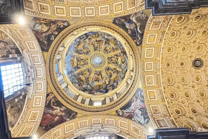 Admire the stunning frescoes and architectural beauty of St. Peter's Basilica dome on a Vatican small group tour.