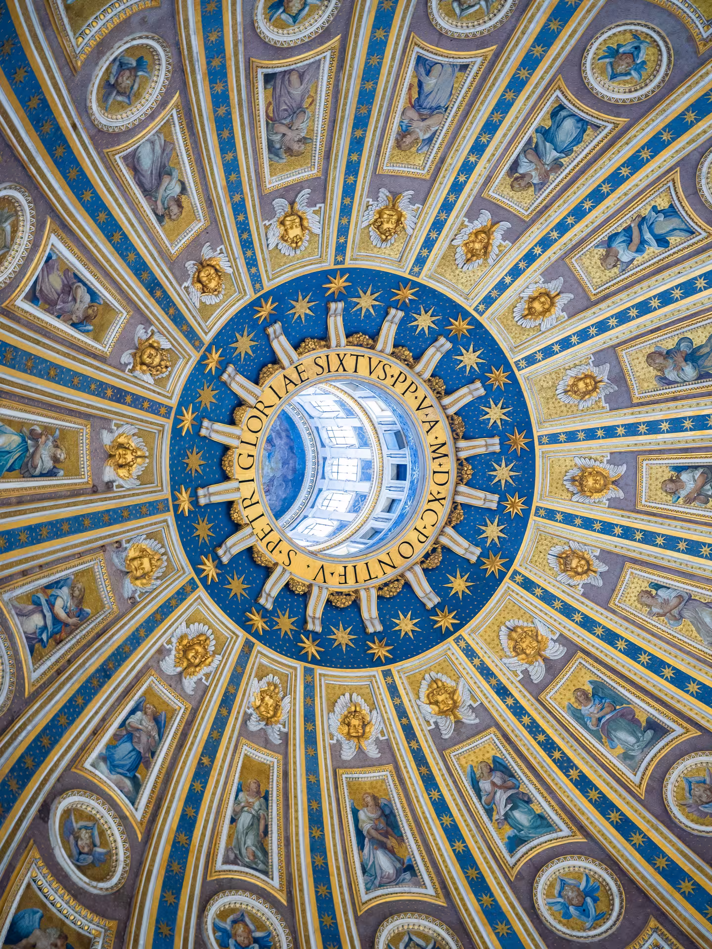 Intricate dome interior of St. Peter's Basilica showcasing stunning Renaissance art and architectural detail.