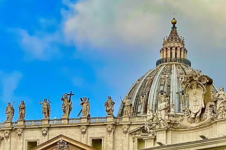 Early morning view of St Peter’s Basilica dome and rooftop statues on a VIP Vatican City private climbing tour in Rome