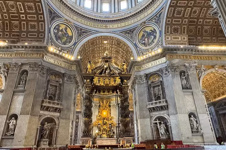 Explore the grandeur of St. Peter's Basilica's ornate interior on a small group private tour in Vatican City.