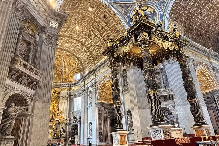 St. Peter's Basilica ornate interior with grand columns and detailed ceiling on a Vatican private tour.