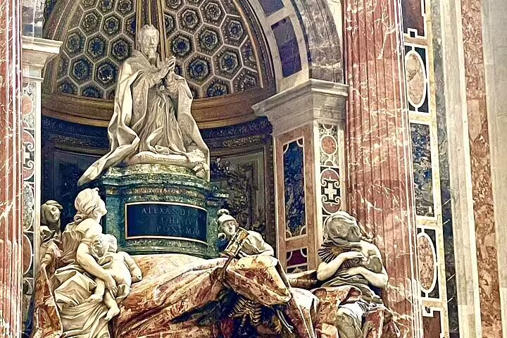 Intricate marble tomb and statues inside St Peter’s Basilica, seen on an early morning VIP dome climb private tour in Rome