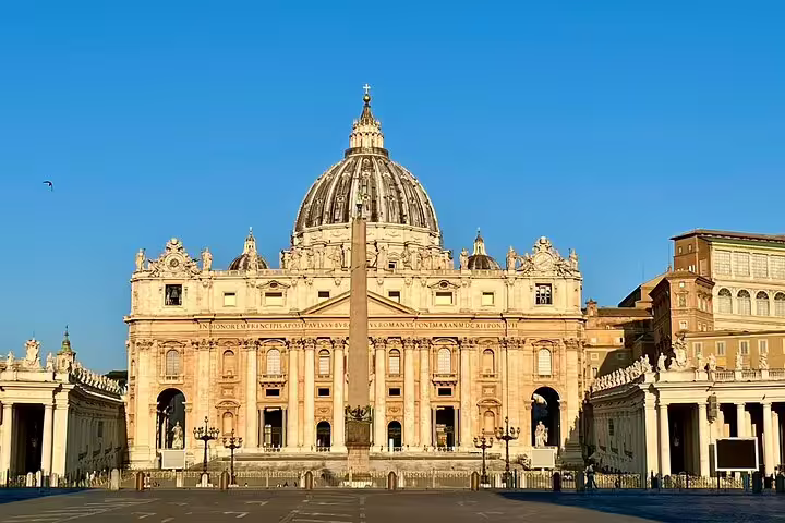 Front view of St Peter’s Basilica and obelisk at dawn, featured stop on Colosseum and Vatican Museums fast-track tour