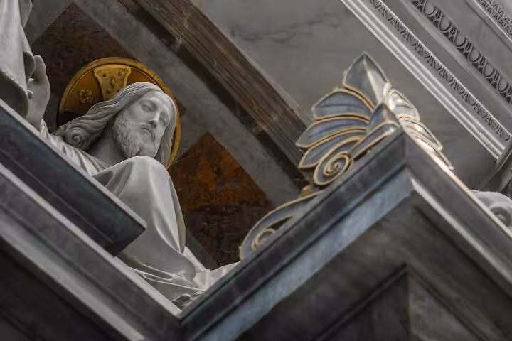 Close-up of a detailed religious statue in St. Peter's Basilica, highlighting Rome's rich cultural heritage.
