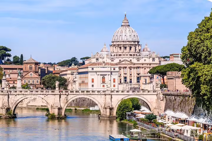 St. Peter's Basilica Vatican dome viewed over Tiber River bridge on Rome self-guided audio scavenger hunt tour