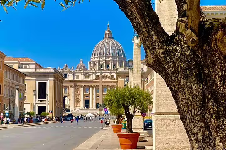 View of St Peter’s Basilica from Via della Conciliazione on a sunny day during an exclusive chauffeured Rome city tour