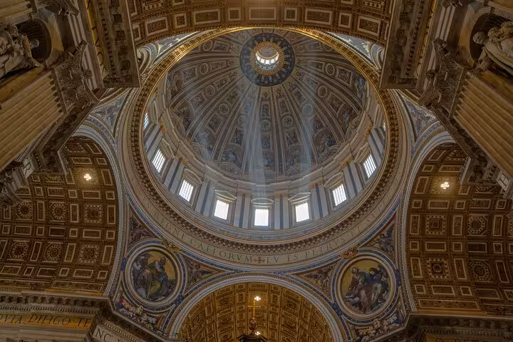 Majestic view of St. Peter's Basilica dome, showcasing intricate Renaissance art on a private Rome exploration tour.