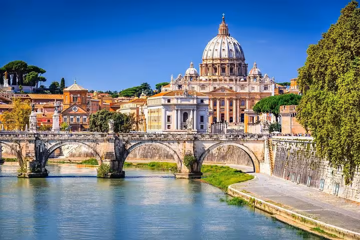 Marvel at St. Peter's Basilica overlooking the Tiber River on a comprehensive shore excursion from Civitavecchia to Rome.