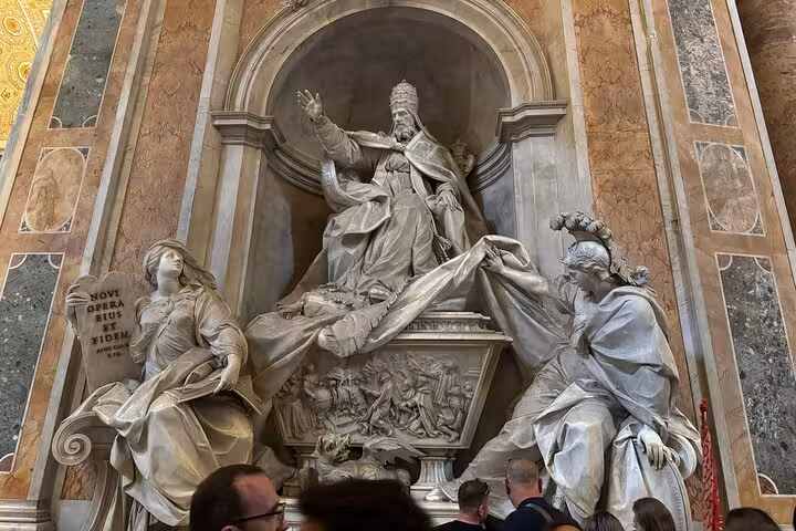 Intricate sculptures inside St Peter's Basilica, highlighting the artistry on a small group private Vatican tour.