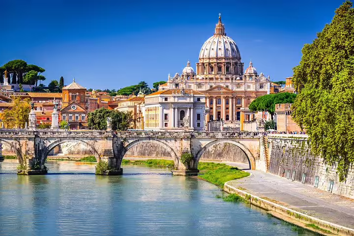 Panoramic view of St Peter’s Basilica and Tiber River bridge on a Rome in 2 Days Colosseum, Vatican and underground catacombs tour
