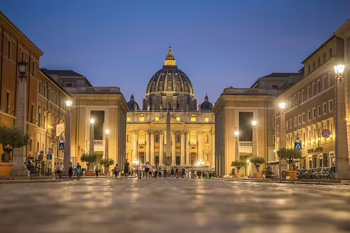 St Peter’s Basilica illuminated at night near Vatican Museums, perfect add-on to Sistine Chapel guided tour