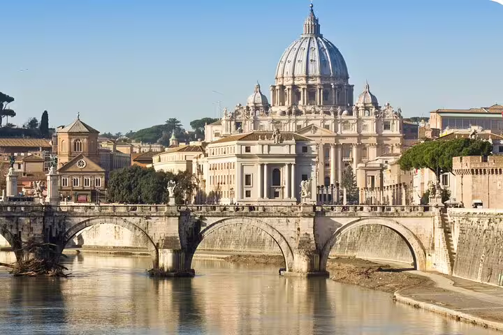 St. Peters Basilica Vatican dome view over Tiber River bridge on Rome scavenger hunt audio tour