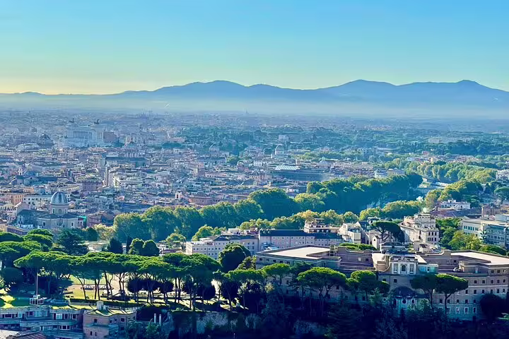Panoramic sunrise view over Rome and Vatican City from St Peter’s Basilica dome on an exclusive early morning VIP tour