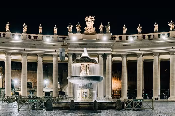 Illuminated fountain at St. Peter's Square in Rome, perfect for a night exploration on a private tour of Vatican City.
