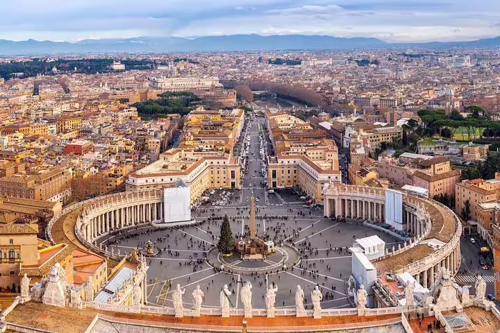 Panoramic view of St Peter’s Square and Rome skyline from the basilica dome on a best of Rome in one day private tour