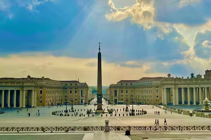 Sunlit St Peter’s Square with central obelisk, a highlight of fast-track Vatican Museums and Sistine Chapel tour in Rome