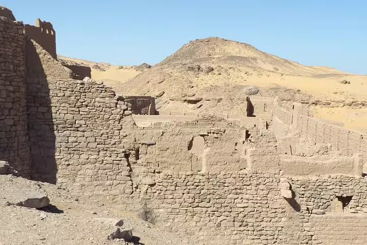 Desert ruins and stone walls near St. Simeon Monastery, Aswan, on guided day trip to ancient monastery site